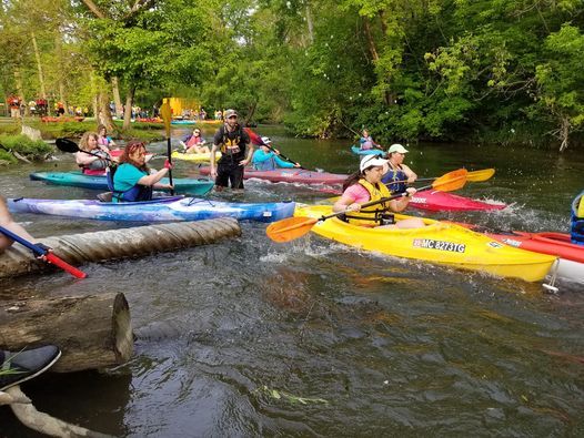 SEMCOG| image: group-kayaking-event-on-wooded-river