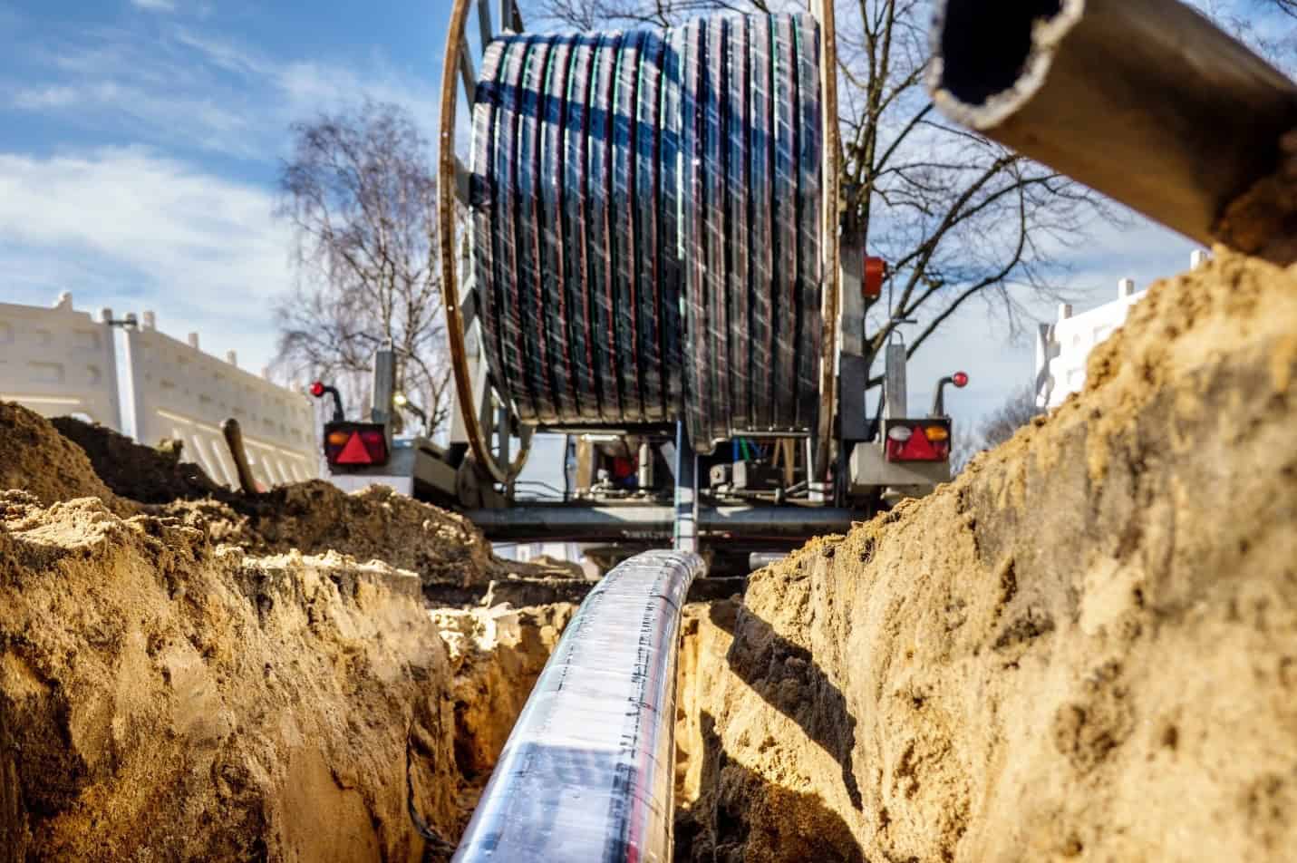 internet cable roll being laid underground