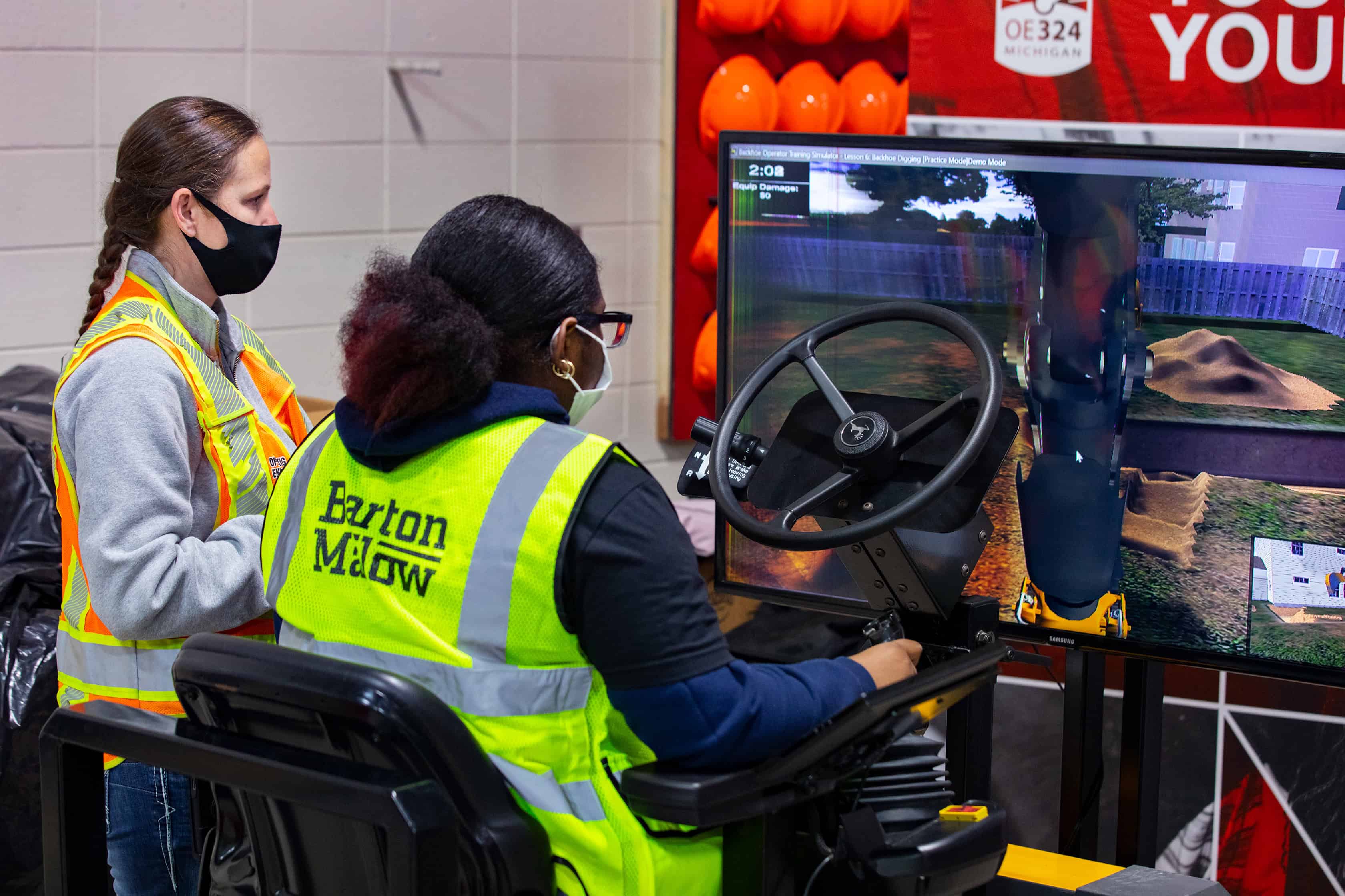 demonstrating technology in construction to high school students