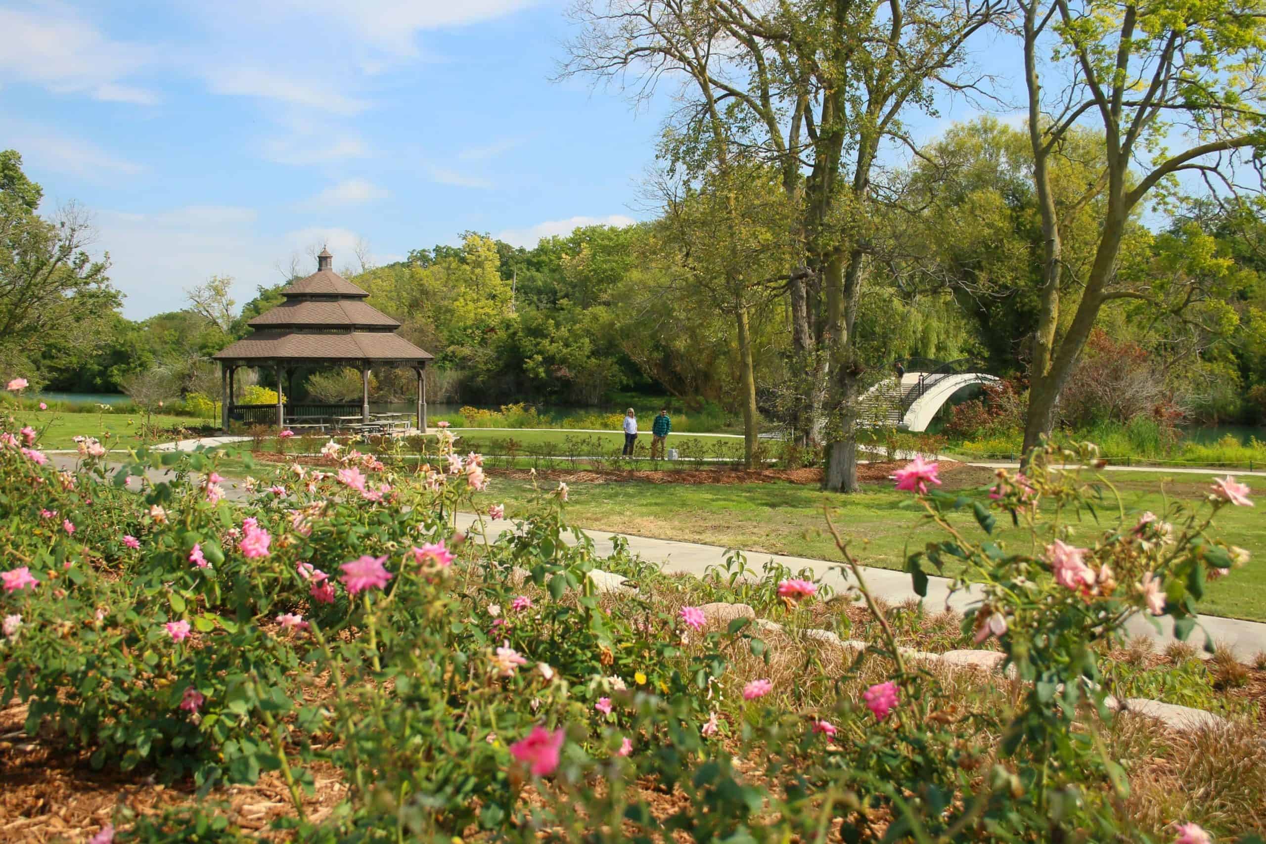 outdoor pavilion with flowers and green grass
