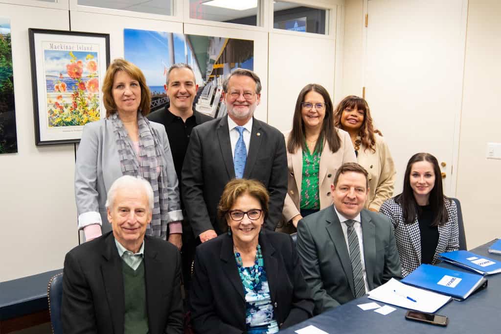 SEMCOG Staff and officers gather for a photo with Senator Gary Peters