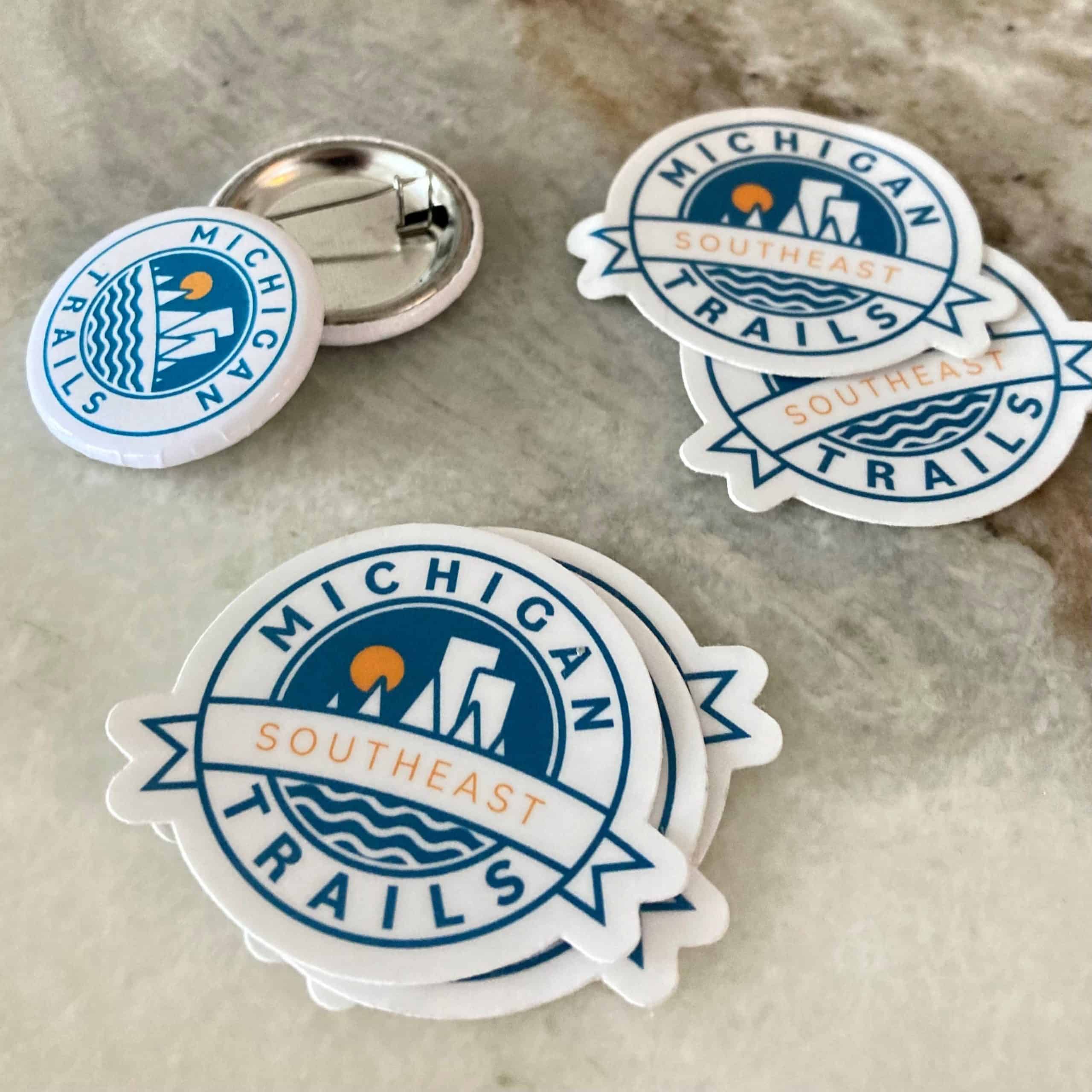 Southeast Michigan Trails pins and stickers