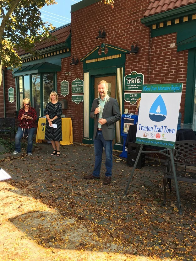 speaker next to Trenton Trail Town poster