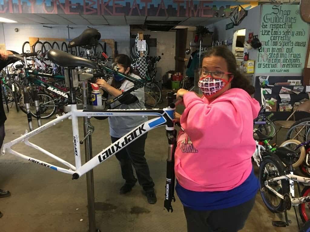 program participant working on bike