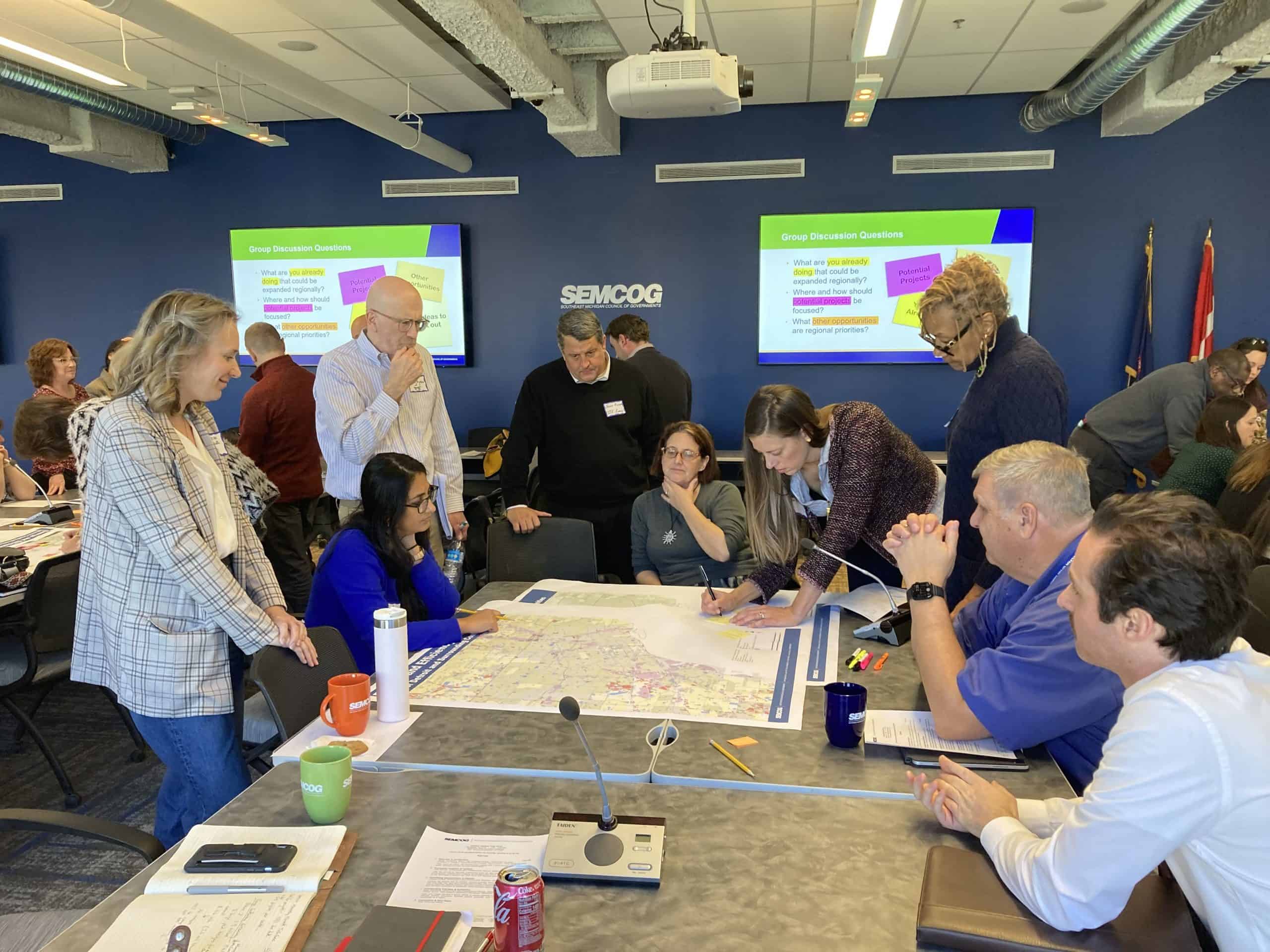 group of people in a meeting room, collaborating