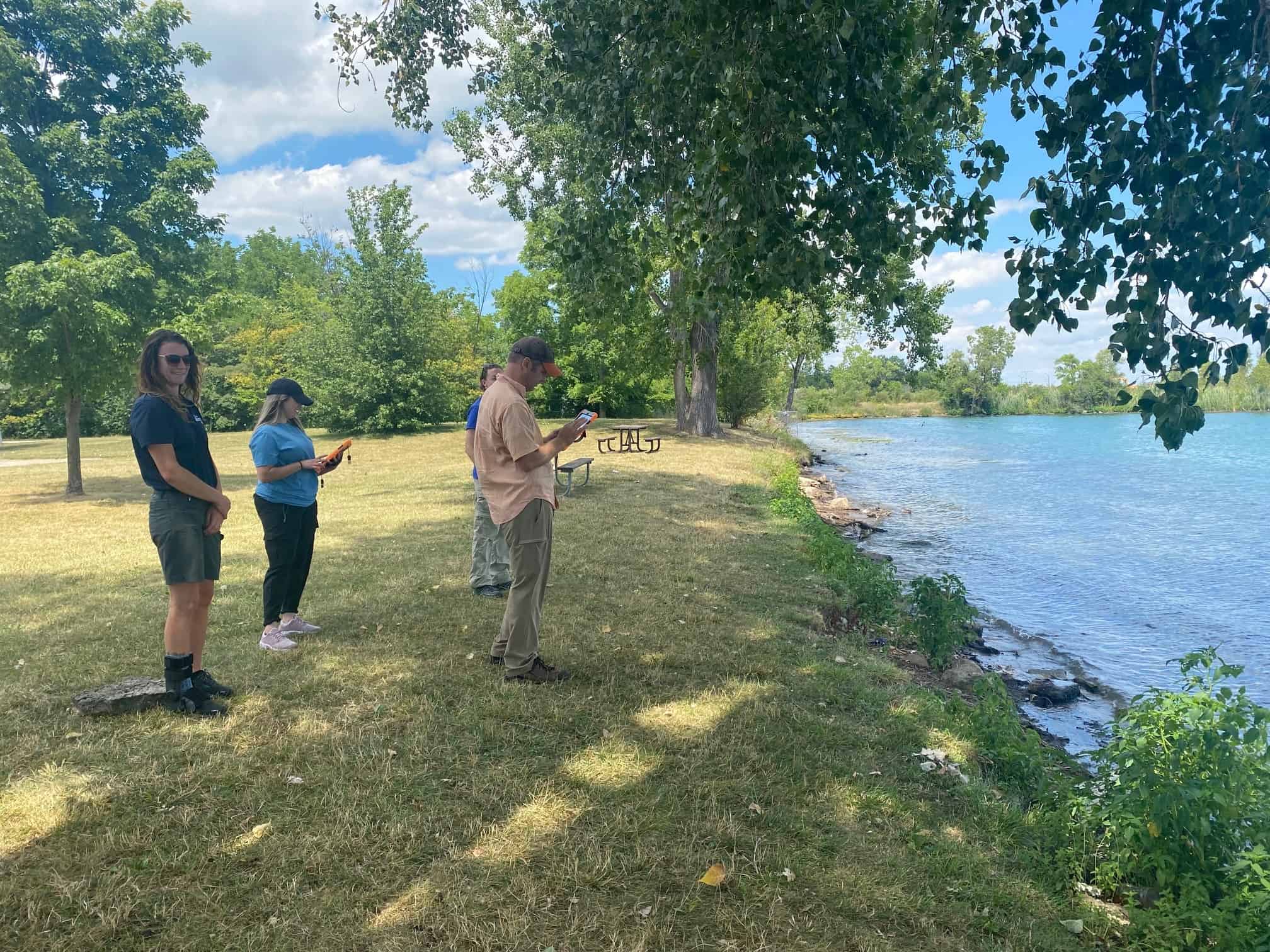Staff working near shoreline