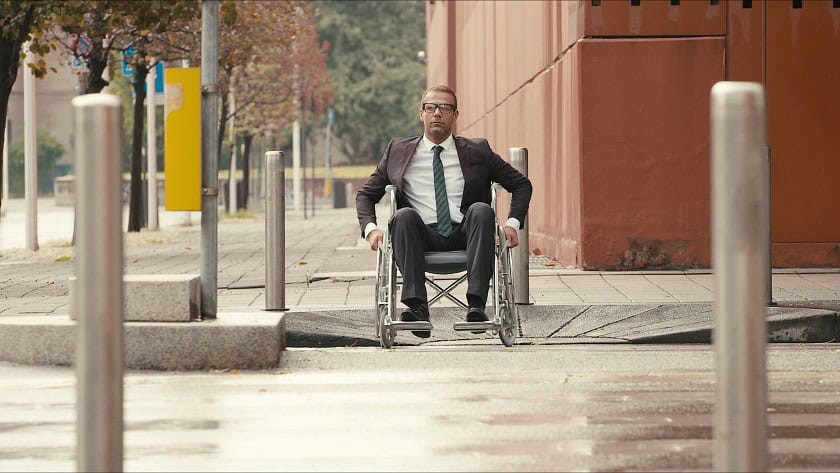 pedestrian in wheelchair using crosswalk
