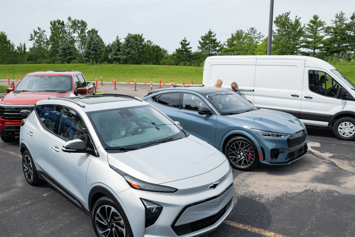 four electric cars outside