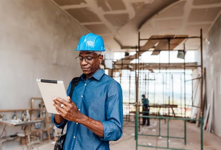 Engineer/investor using tablet at construction site