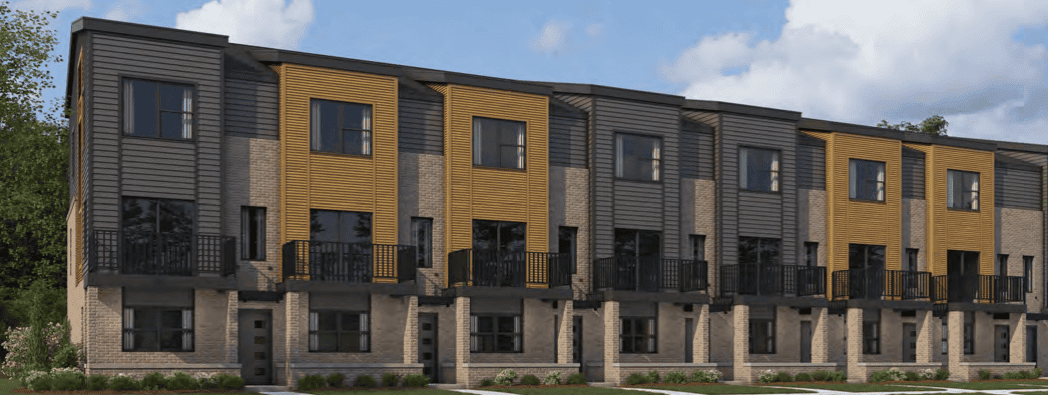A row of modern townhouses with a combination of gray and yellow siding, each featuring balconies and individual entrances.