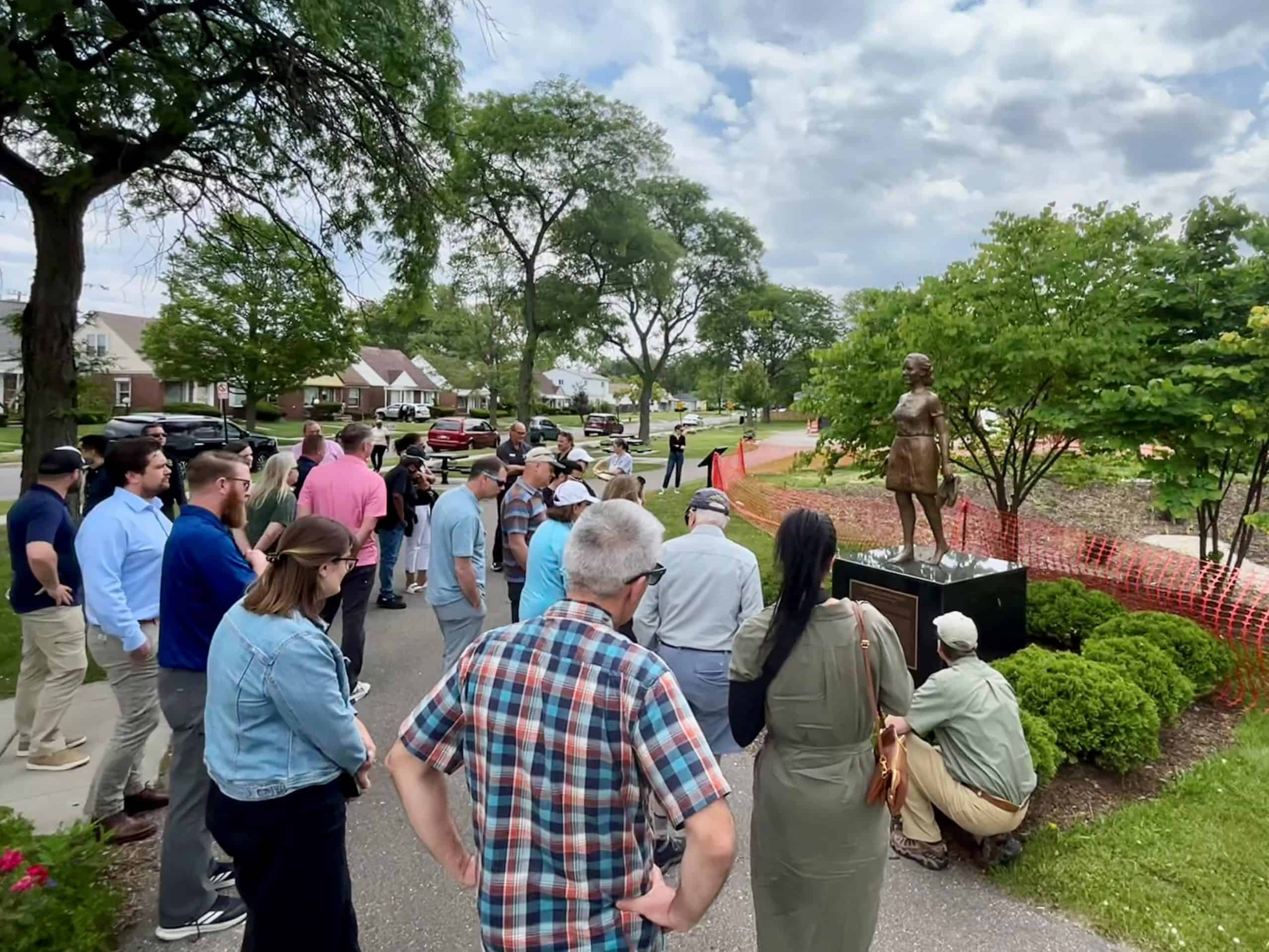 Crowd looking at sculpture in Viola Liuzzo Park, Detroit