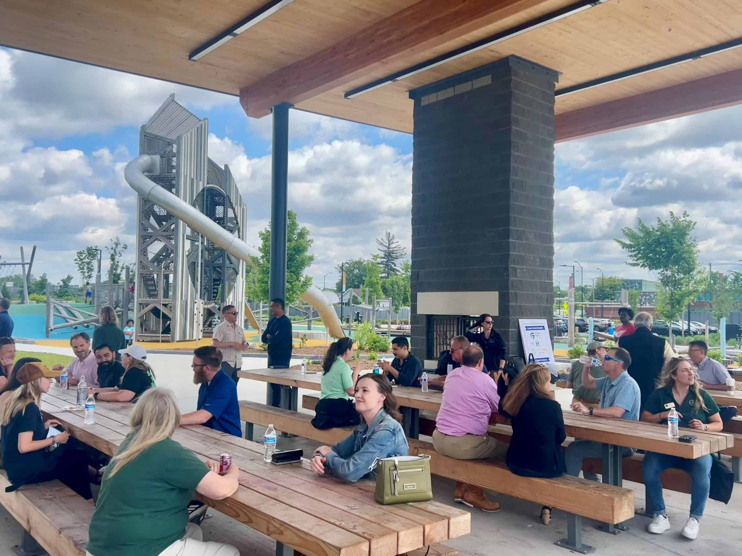 People sitting at a picnic area in Joe Louis Greenway, Detroit