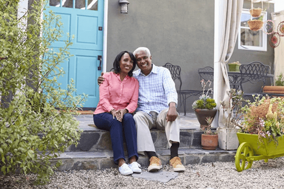 two generations sitting together on a doorstep