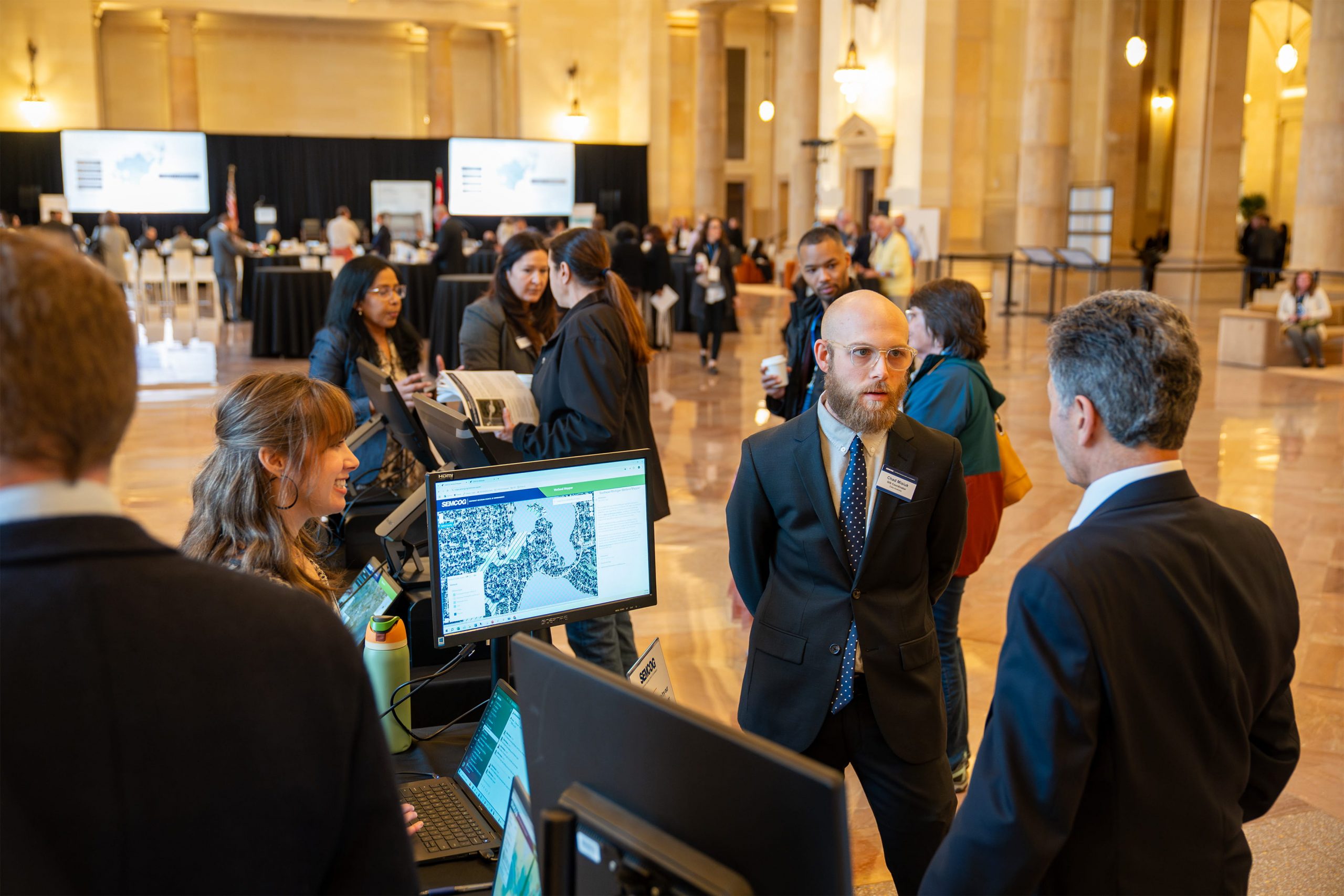 Attendees networking at the March General Assembly 2025, Michigan Central Station